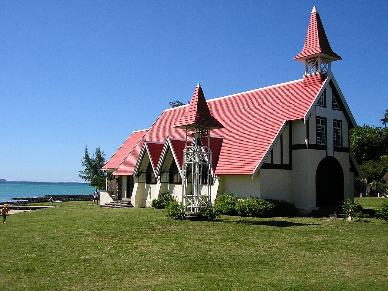 The Red Roof Church of Cap Malheureux overlooking the turquoise sea in northern Mauritius